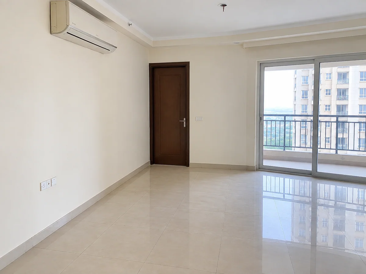 Living room — stained, patchy walls repainted flat — after