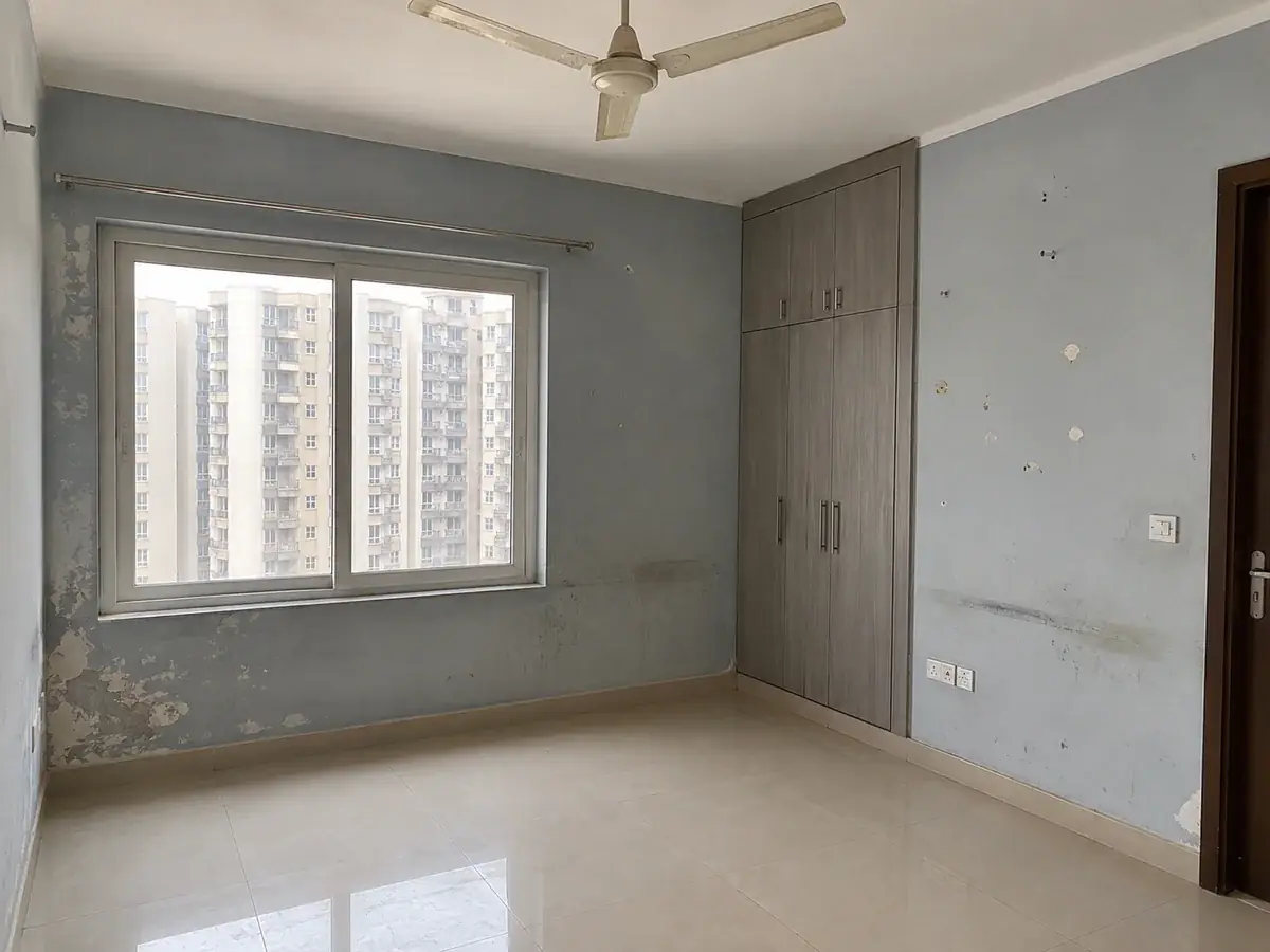 Bedroom — blotchy blue-grey stripped back and recoated in sage — before